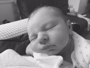 Black and white image of a baby