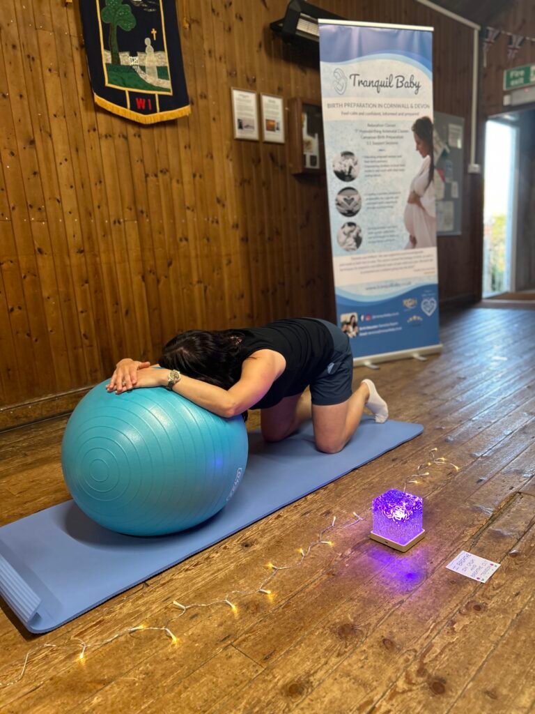 Pregnancy yoga using birth ball